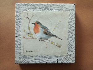 Rouge gorge sur une branche avec écriture sur toile