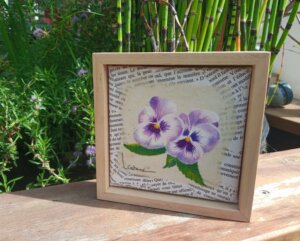 Deux pensées violettes avec écritures sur toile